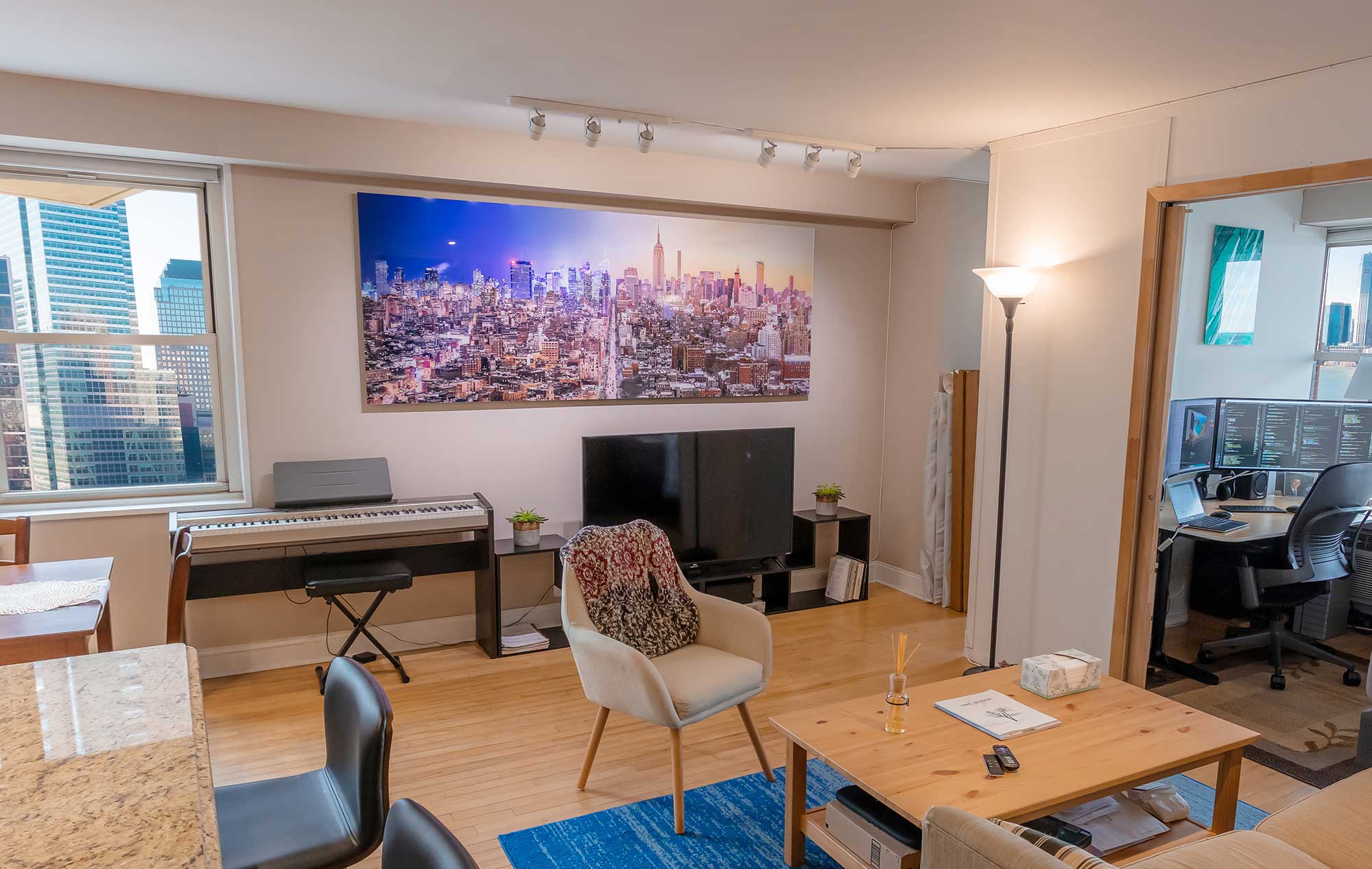 A VAST Display of "New York Transitions I" by Dan Piech in a living room.