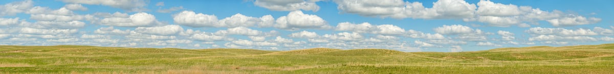 1,103 megapixels! A very high resolution, gigapixel panorama photo of rolling hills of fields under a blue sky spotted with puffy white clouds; landscape photograph created by Jerred Zegelis in Hyannis Nebraska.