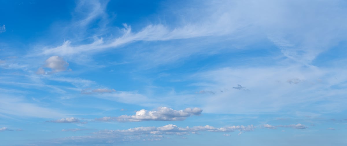 313 megapixels! A very high resolution, large-format VAST photo of a beautiful blue sky with wispy white clouds and a few puffy white clouds; stock photograph created by Assaf Frank and available to be licensed and downloaded.