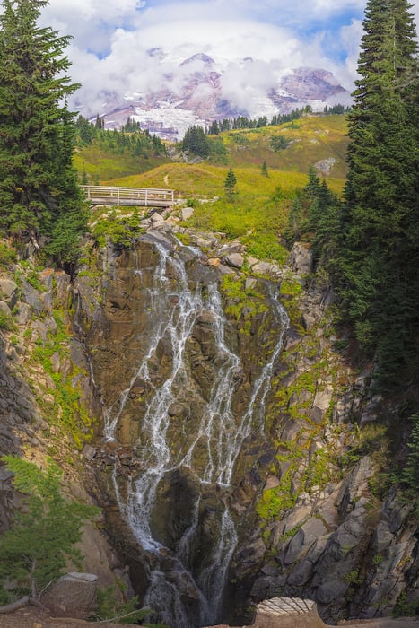 1,879 megapixels! A very high resolution, large-format VAST photo print of a waterfall with a bridge over the top an Mount Rainier in the background; waterfall photograph created by John Freeman in Mount Rainier National Park, Washington.